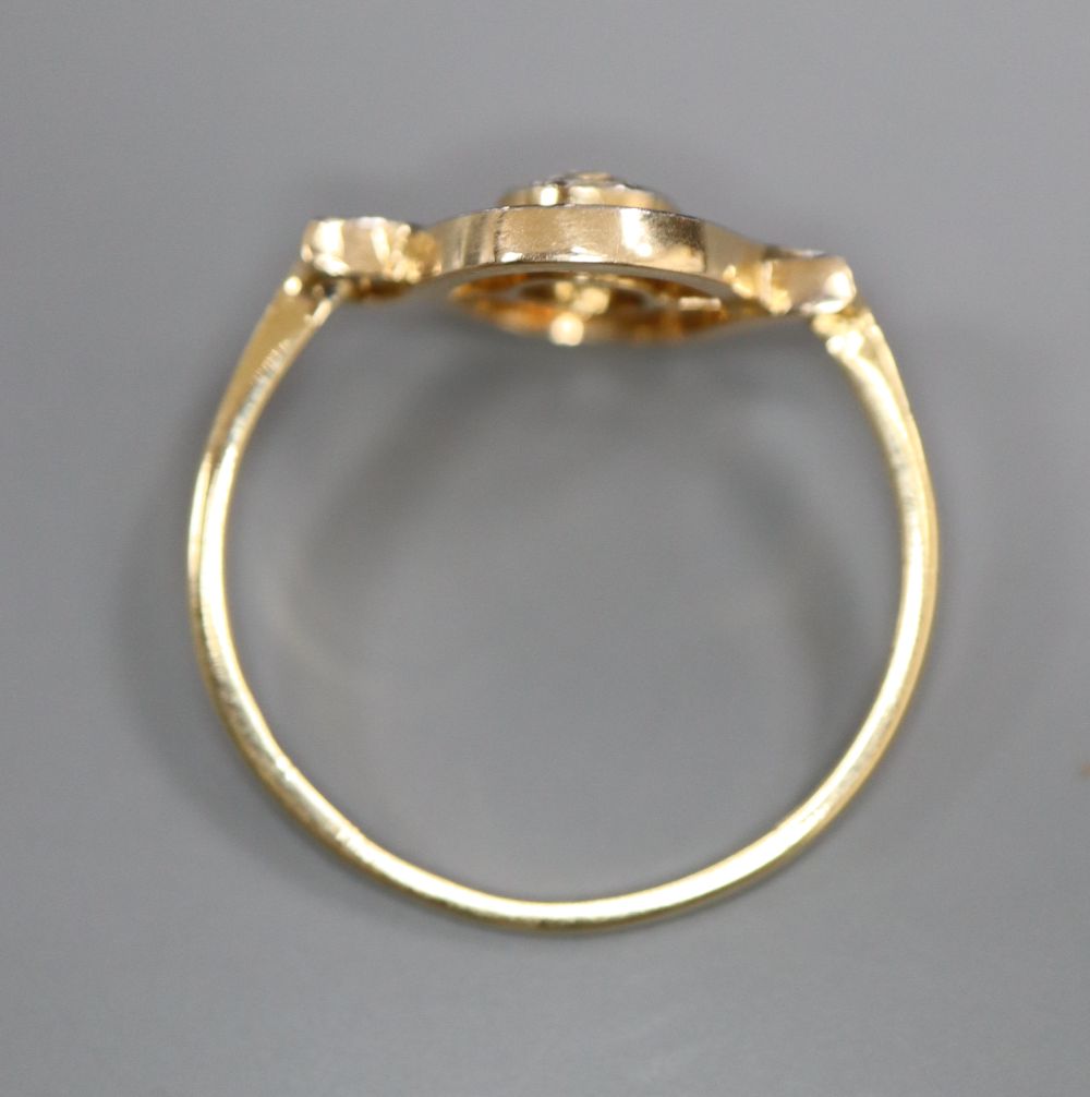 An 18ct and solitaire diamond set ring, in openwork setting, size M, gross 2.2 grams.